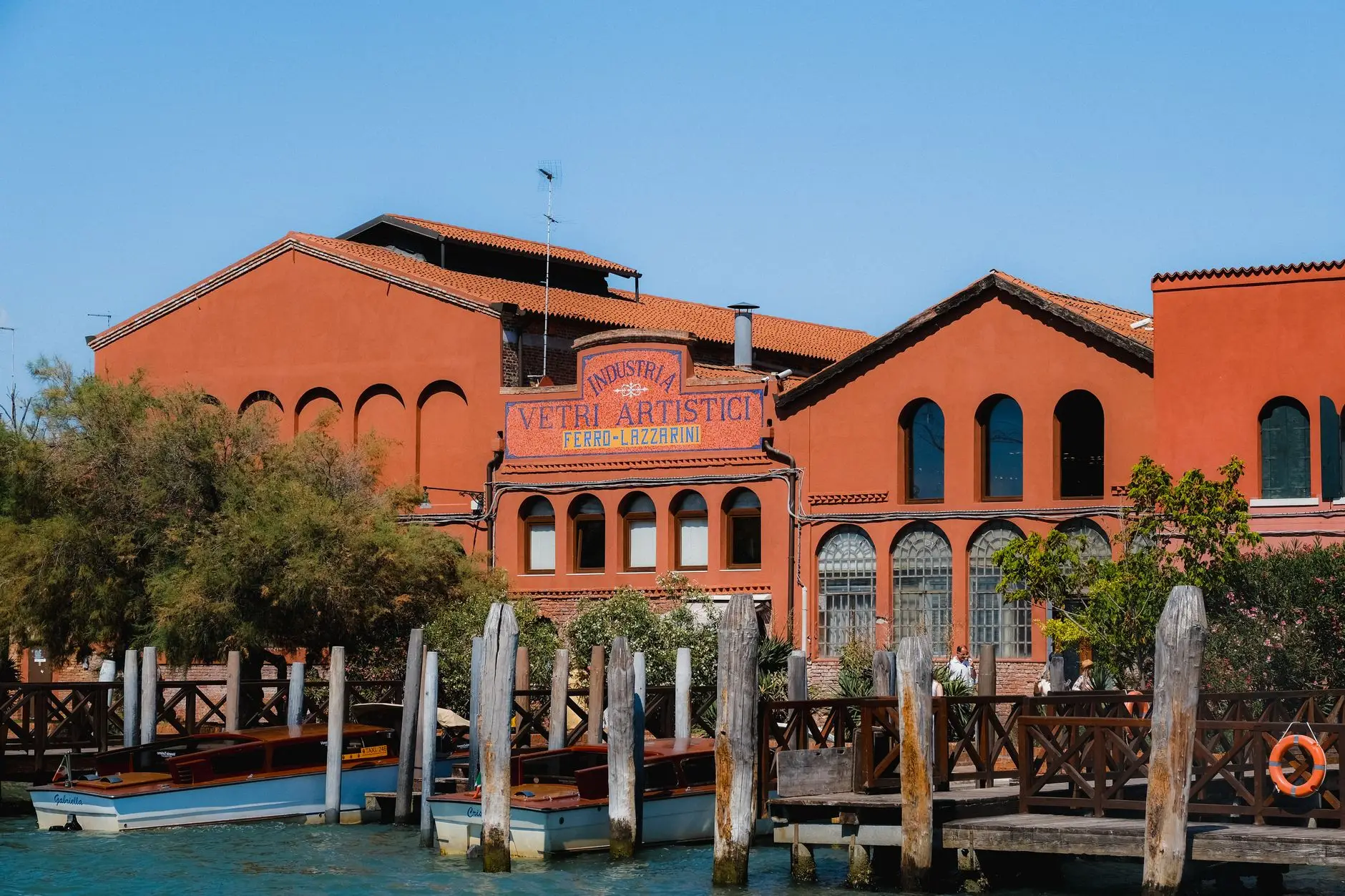 Picturesque view of a traditional glass factory on Murano, Venice. Vibrant colors and historic charm.