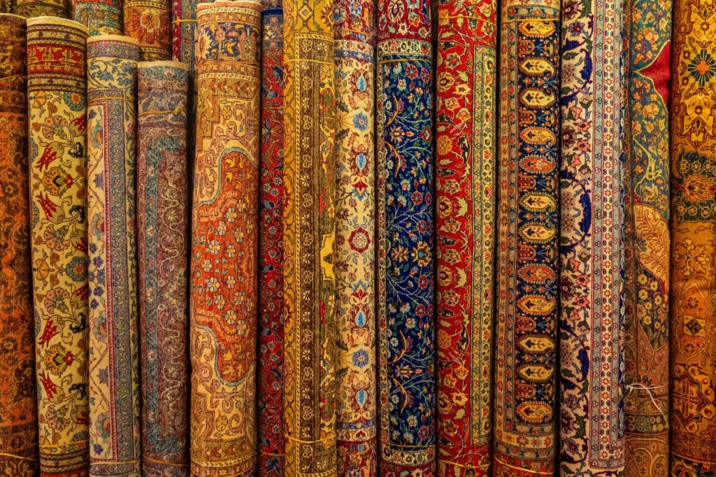 A vibrant collection of traditional Persian rugs with intricate designs and rich colors.