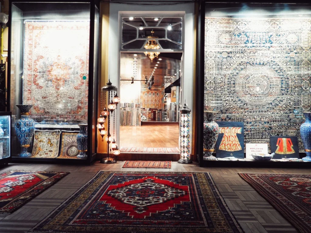 Showcasing intricate Persian rugs and decorative vases at an upscale boutique.