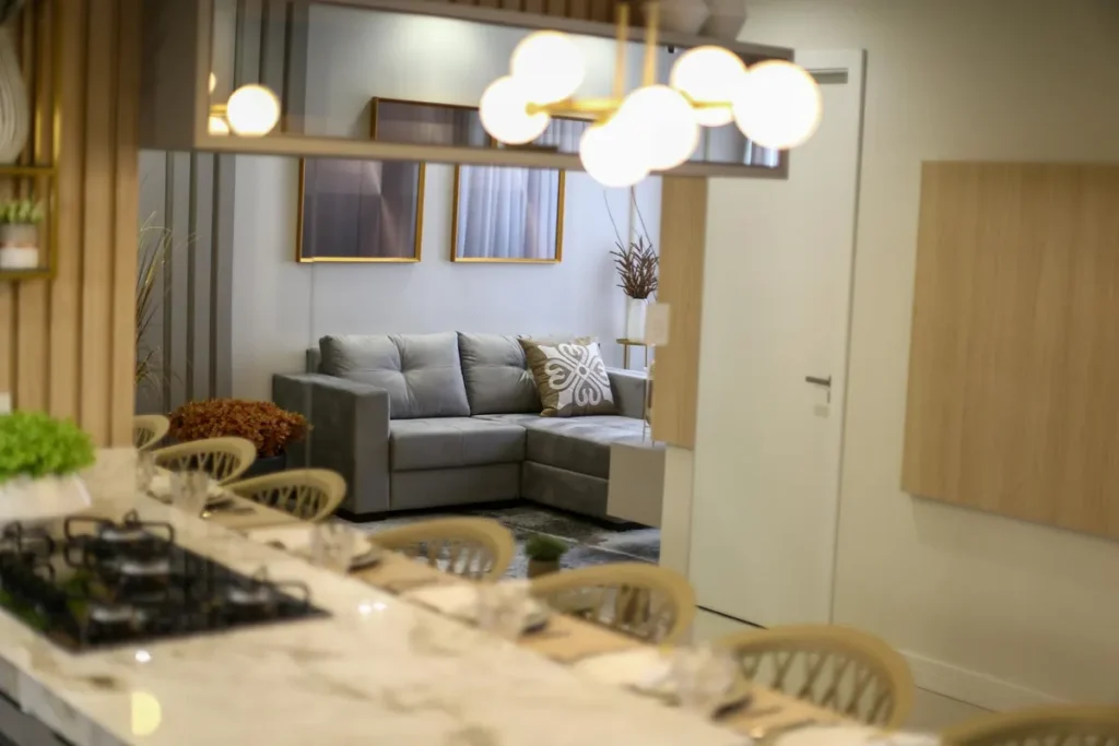 A stylish and elegant modern living room with a gray sofa and chic decor.